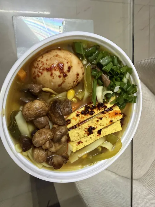 Veg thukpa in rice noodles with tofu & pickled soy egg