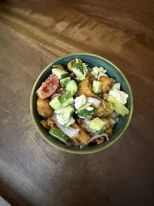 Salad bowl topped with fritters for crunch